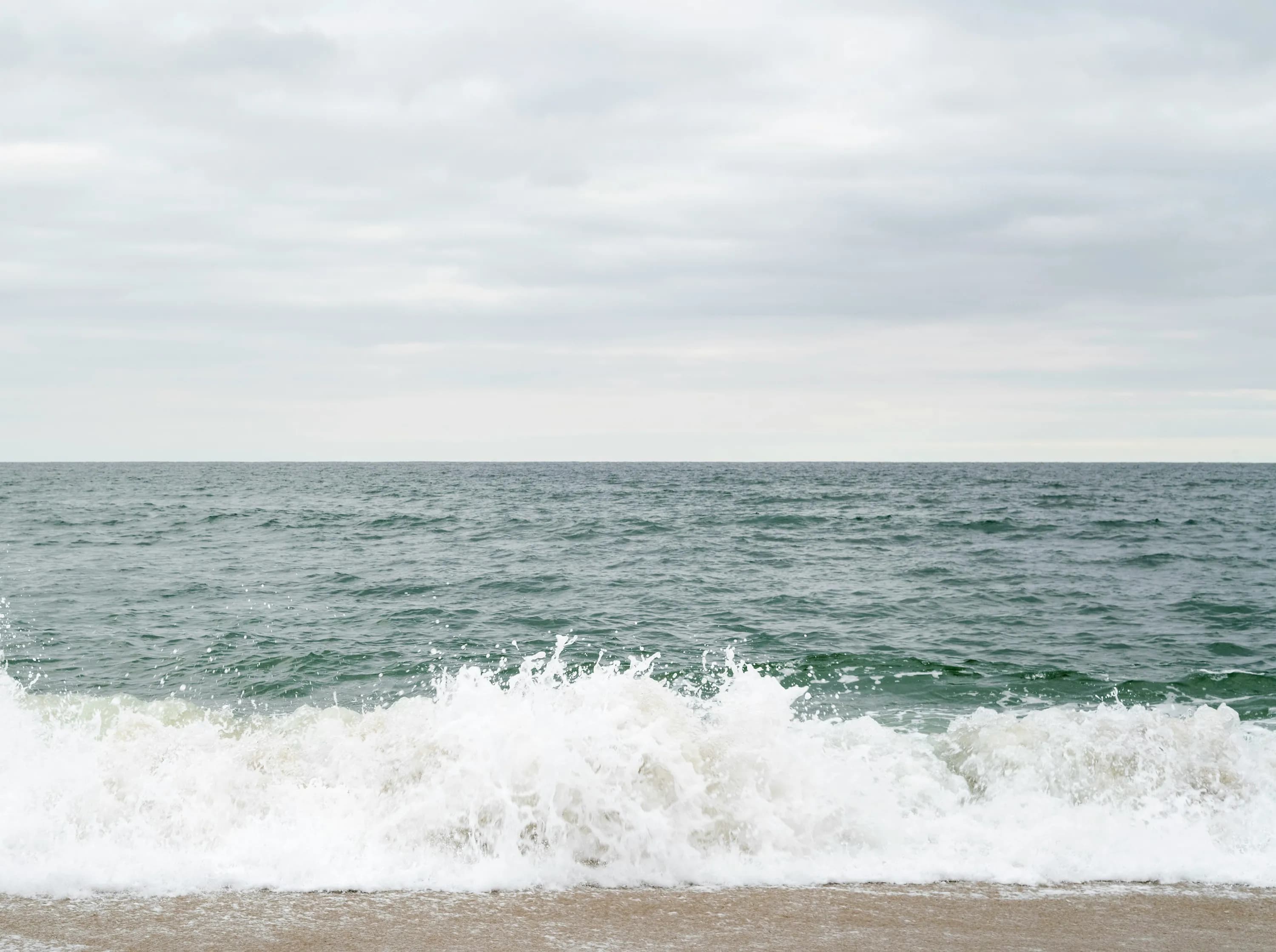 Ocean wave hitting the shore on a beach